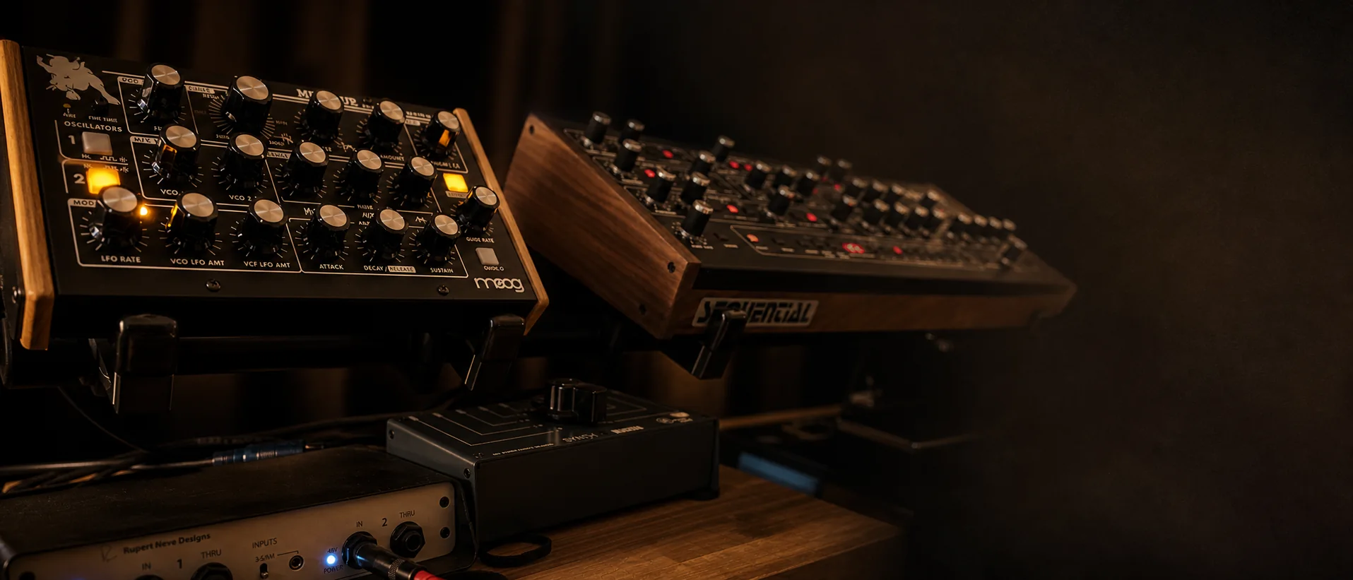 Vintage synthesizers under warm studio light